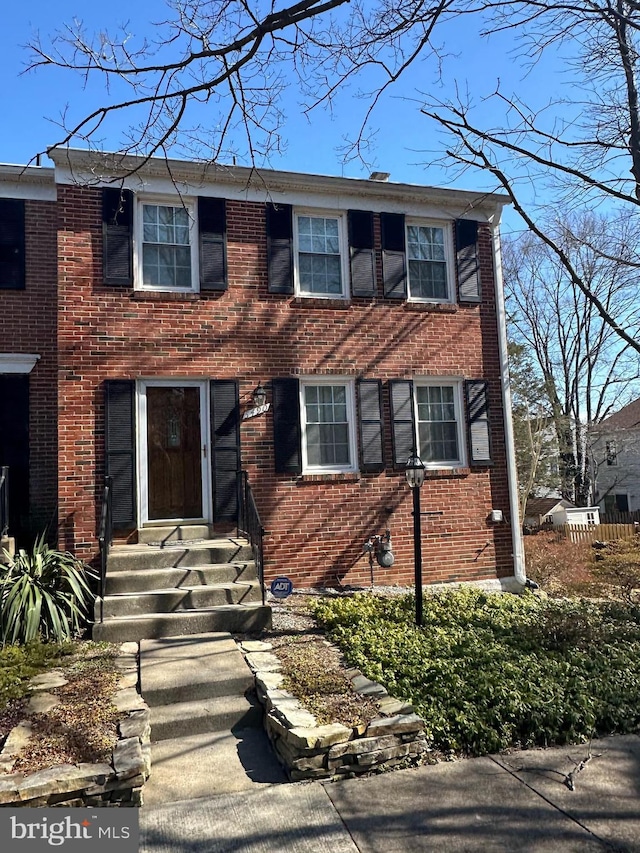 view of front of property featuring brick siding