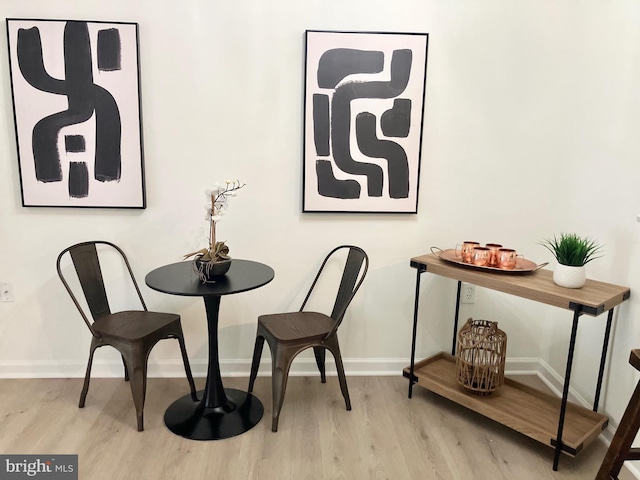 12919 Alton Sq Unit 120, Herndon, VA 20170 - dining area featuring wood finished floors and baseboards