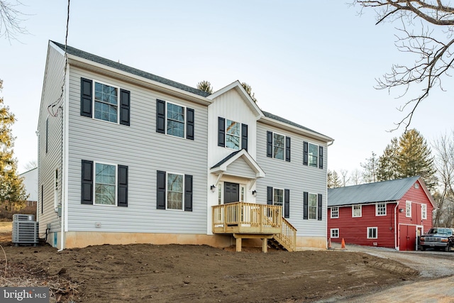 colonial-style house with cooling unit