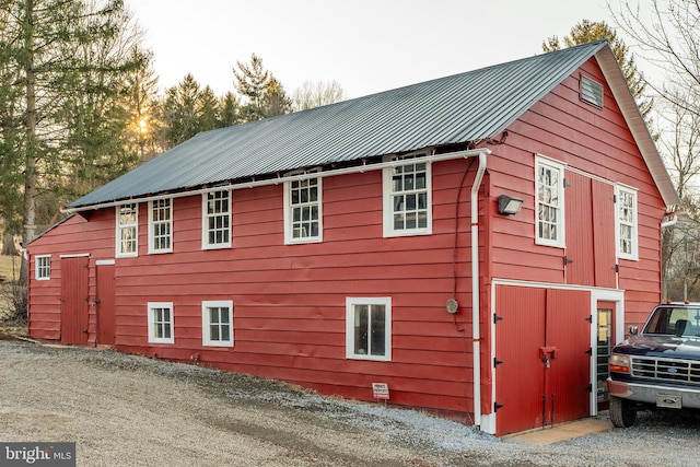 view of property exterior with metal roof