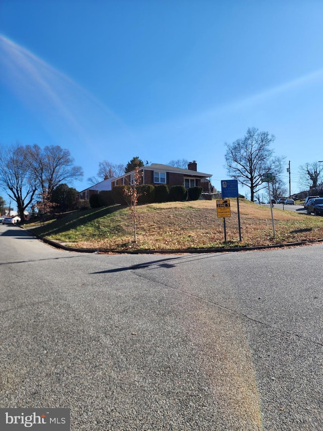 view of street with curbs