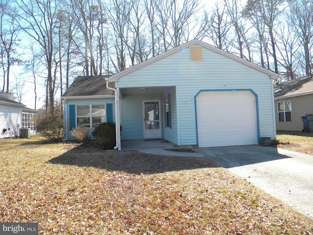 ranch-style home featuring a garage, a front yard, driveway, and central AC unit