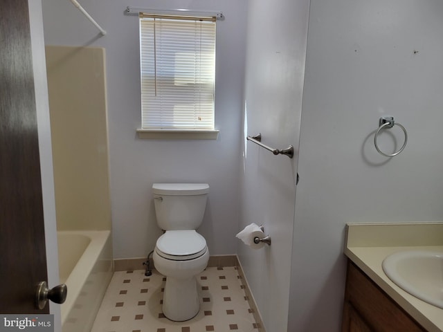 full bathroom with baseboards, vanity, and toilet