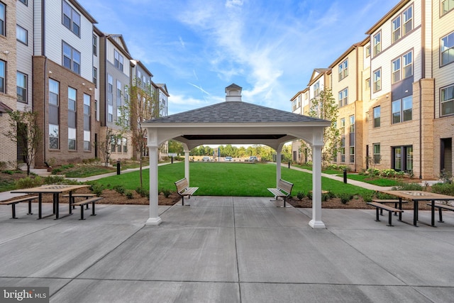 view of community with a lawn and a gazebo