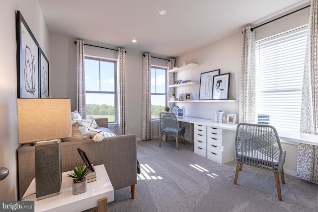 office area with baseboards, recessed lighting, built in study area, and light colored carpet