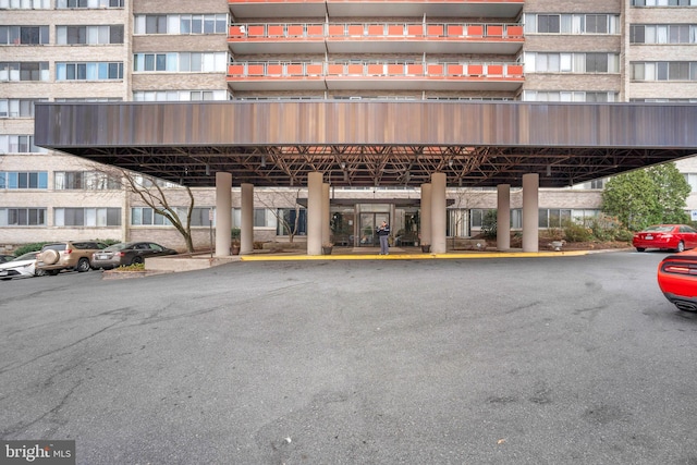 view of building exterior with covered parking