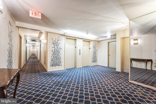 below grade area with carpet flooring and elevator