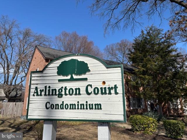 community sign featuring fence