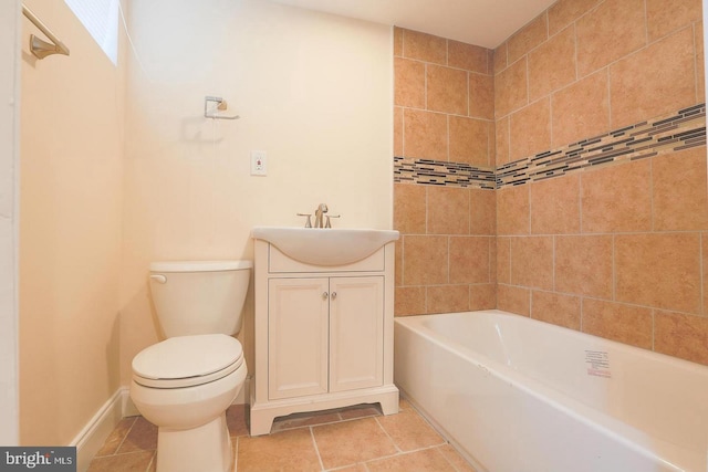 bathroom featuring vanity, tile patterned flooring, toilet, and baseboards