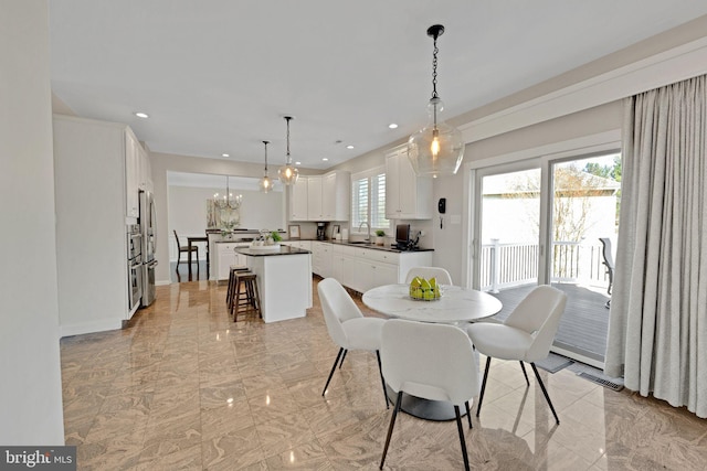 dining area featuring recessed lighting, visible vents, a notable chandelier, and marble finish floor