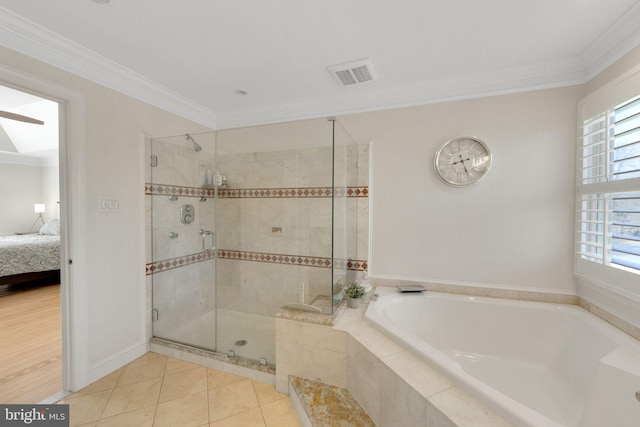 bathroom featuring connected bathroom, ornamental molding, a shower stall, and a bath