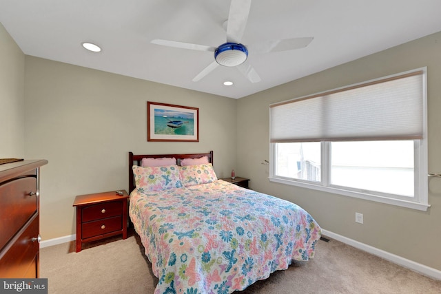 bedroom featuring light carpet, recessed lighting, a ceiling fan, and baseboards