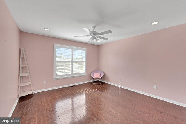 unfurnished room with a ceiling fan, recessed lighting, wood finished floors, and baseboards