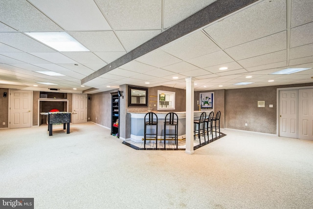 interior space with baseboards, recessed lighting, a bar, and carpet