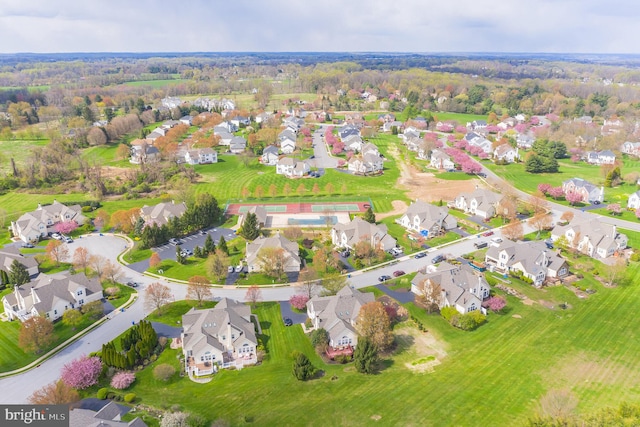 birds eye view of property with a residential view