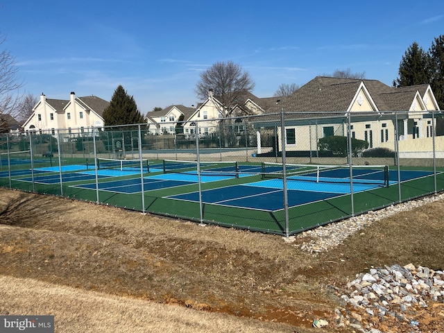 view of tennis court with fence