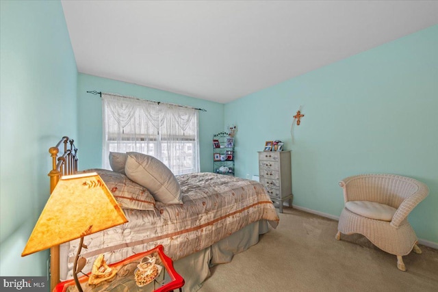 bedroom with carpet and baseboards