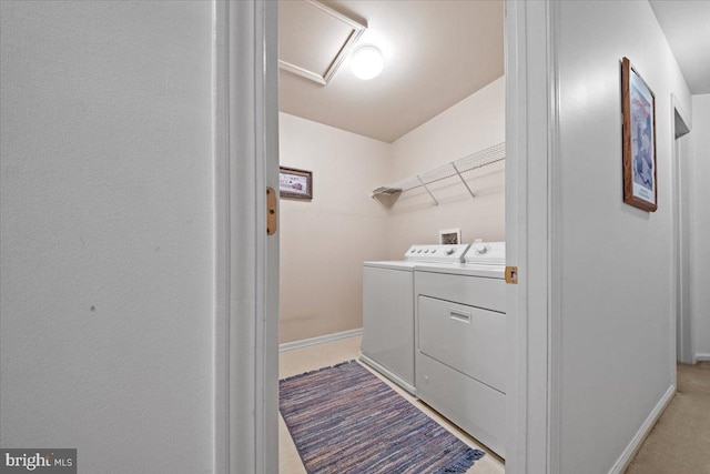 washroom featuring laundry area, attic access, baseboards, and independent washer and dryer