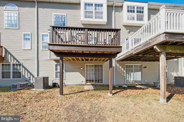 back of property featuring a deck and central air condition unit