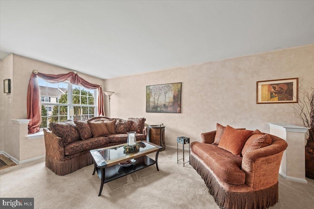 living room with carpet flooring and baseboards