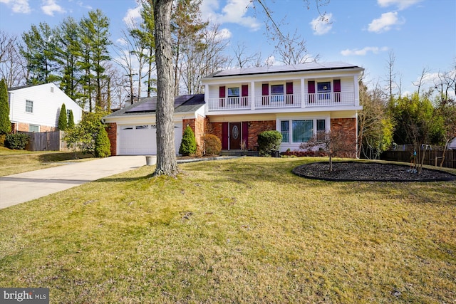 traditional home featuring brick siding, driveway, a front yard, and fence