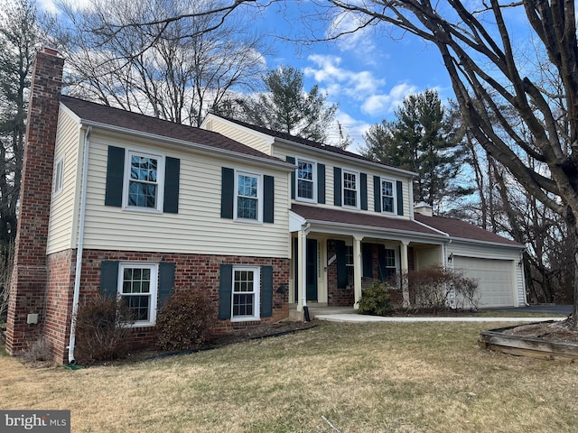 view of front of property featuring brick siding, a front lawn, a chimney, and an attached garage