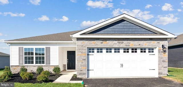 craftsman inspired home featuring driveway, stone siding, and a garage