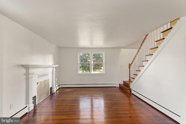 unfurnished living room featuring a fireplace with flush hearth, stairway, baseboard heating, and wood finished floors