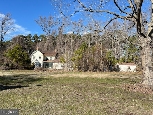 view of yard featuring a view of trees