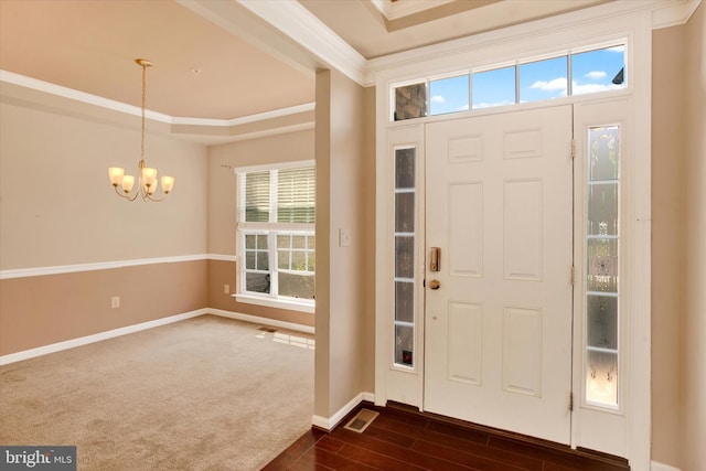 13010 Davenport Dr, Brandywine, MD 20613 - entryway featuring dark wood finished floors, visible vents, baseboards, an inviting chandelier, and ornamental molding