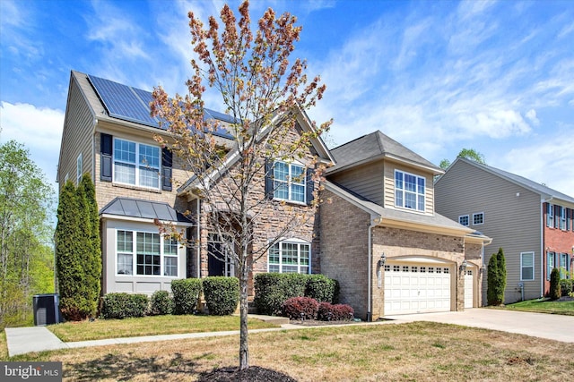 13010 Davenport Dr, Brandywine, MD 20613 - traditional-style house with driveway, brick siding, an attached garage, roof mounted solar panels, and a front yard
