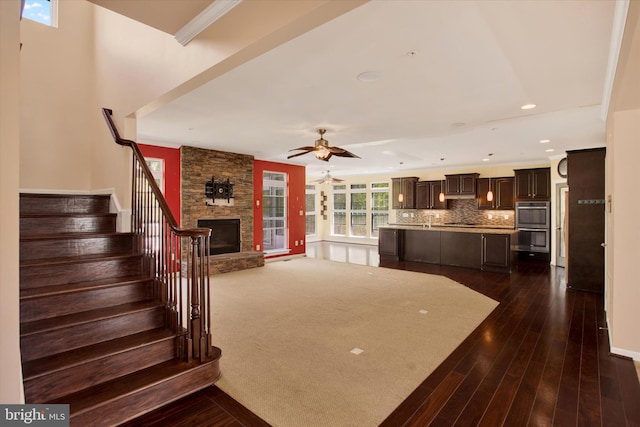 13010 Davenport Dr, Brandywine, MD 20613 - unfurnished living room with recessed lighting, stairway, a stone fireplace, a ceiling fan, and dark wood-style flooring