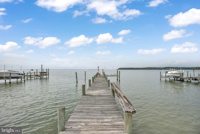 view of dock with a water view and boat lift