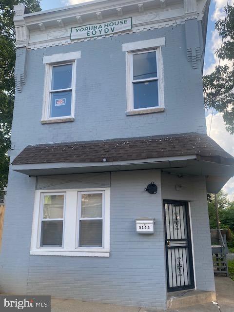 exterior space with brick siding