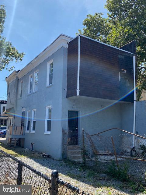 view of property exterior with fence