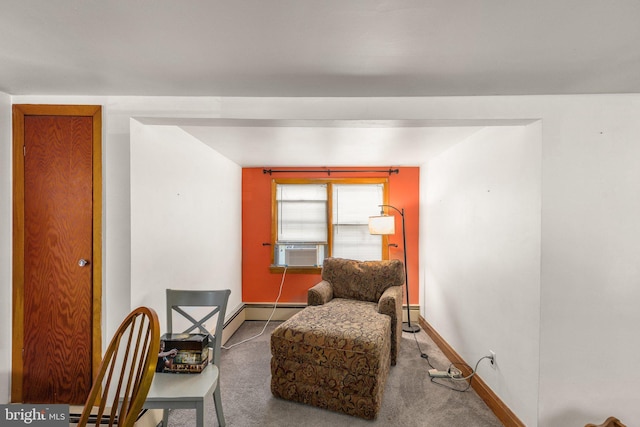 sitting room with carpet floors, cooling unit, and baseboards