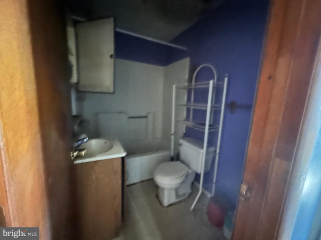 bathroom featuring toilet and vanity