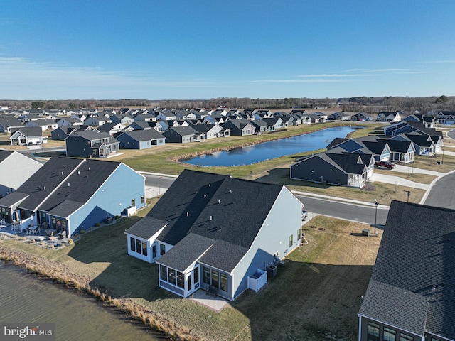 birds eye view of property with a residential view and a water view