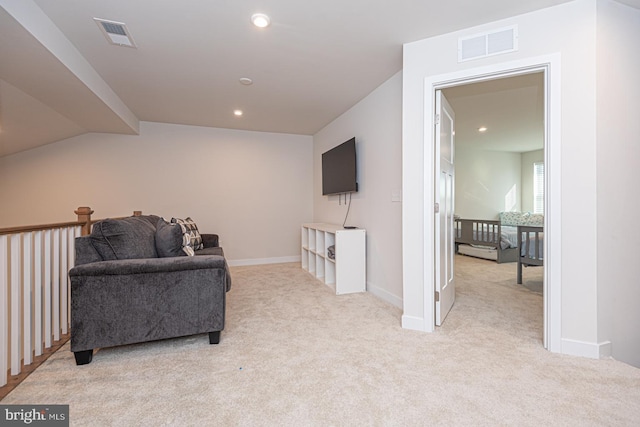 sitting room with carpet floors, recessed lighting, and visible vents