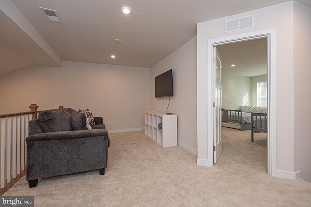 living area with light carpet, baseboards, visible vents, and recessed lighting