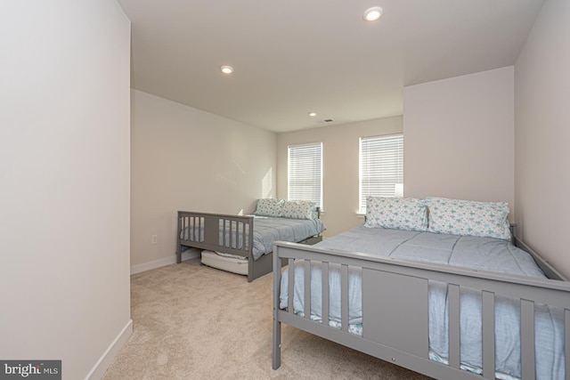 carpeted bedroom with recessed lighting and baseboards