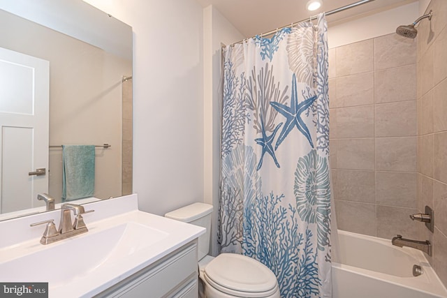 full bathroom with shower / tub combo with curtain, vanity, and toilet