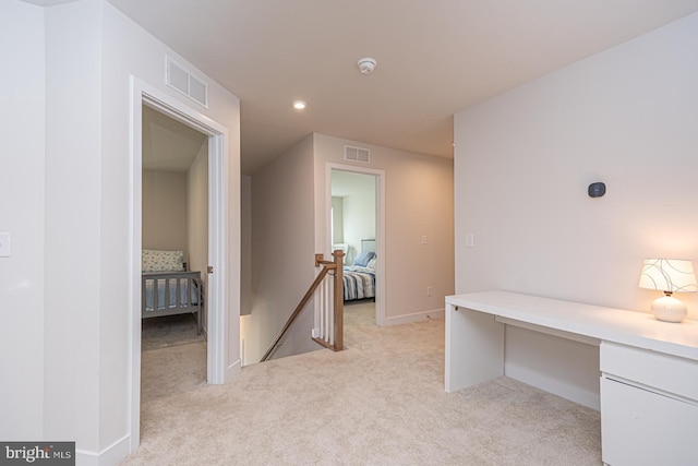 office area featuring light colored carpet, visible vents, baseboards, and recessed lighting