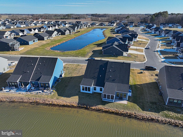 aerial view featuring a water view and a residential view