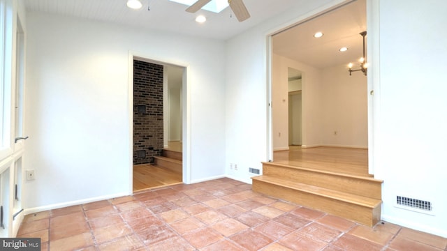 spare room with baseboards, a ceiling fan, visible vents, and recessed lighting