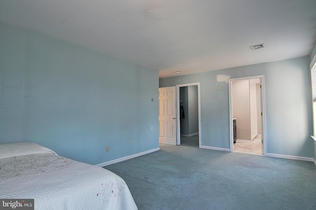 bedroom featuring carpet flooring, visible vents, and baseboards