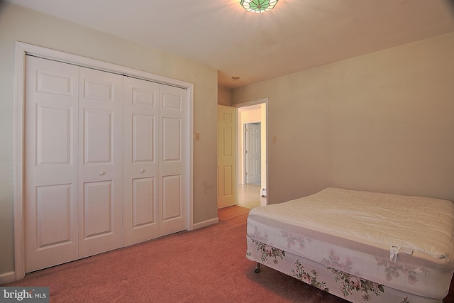 bedroom featuring a closet and carpet