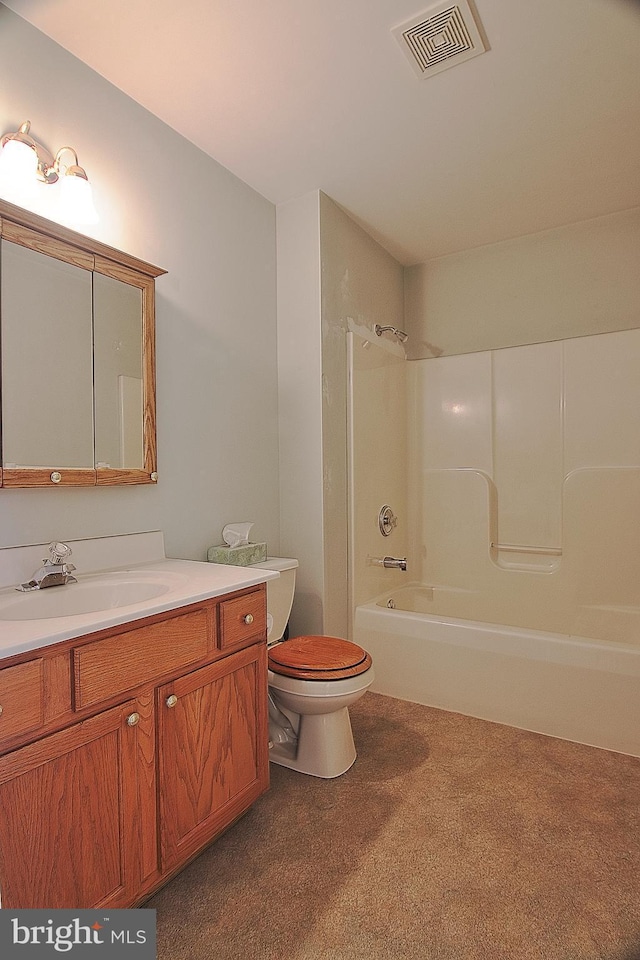 full bathroom featuring washtub / shower combination, visible vents, vanity, and toilet