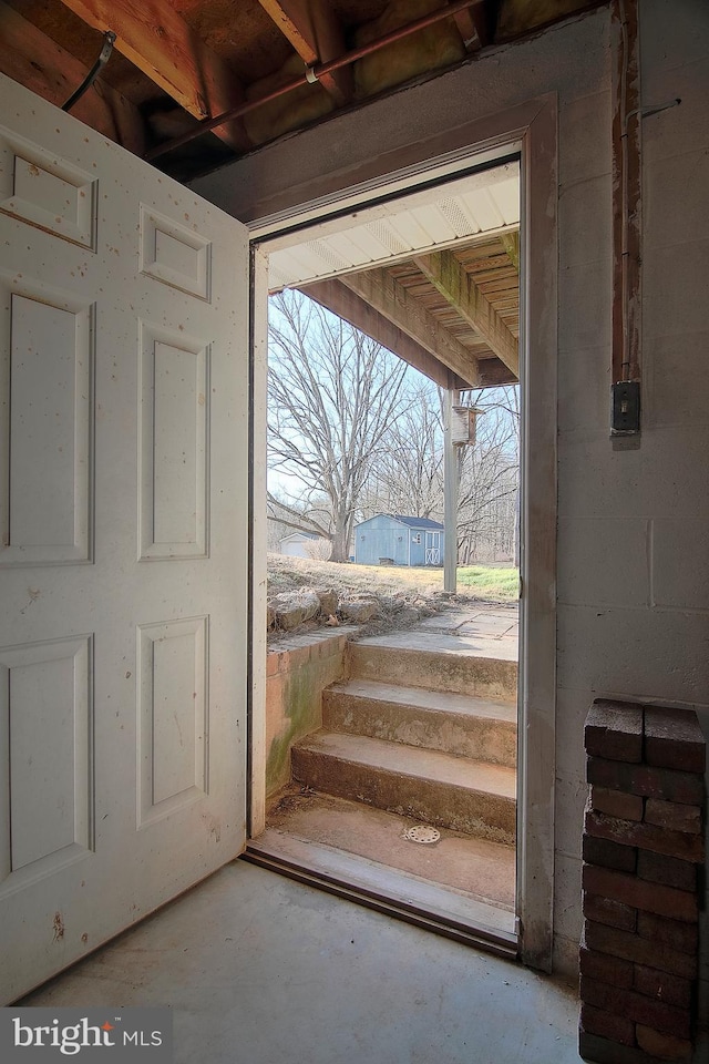 entryway with concrete floors and a healthy amount of sunlight