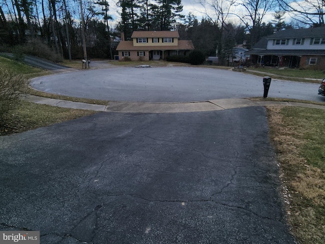 view of road featuring aphalt driveway